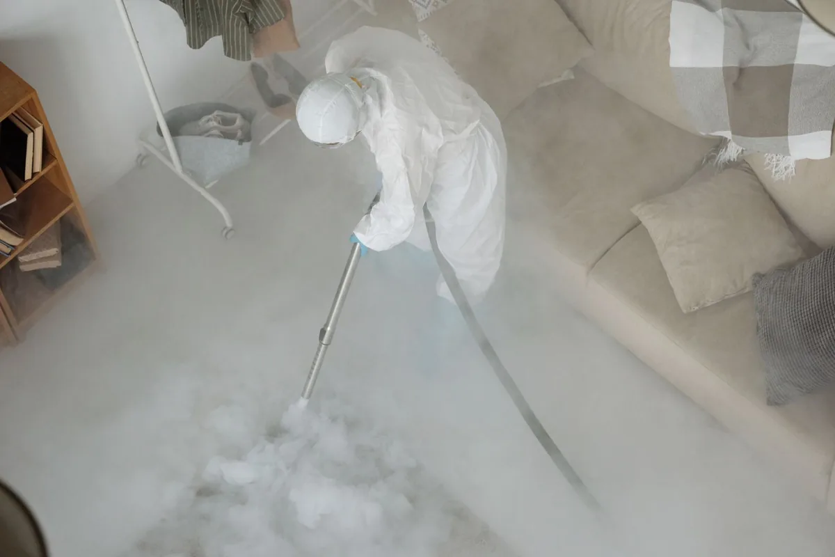 Biohazard cleanup technician in protective equipment, Park Place, Houston, TX